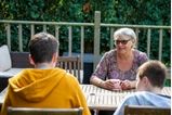 foster carer with children having a coffee